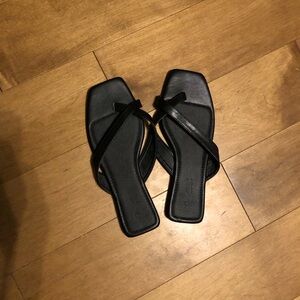 Size 7 black sandals. Never worn.